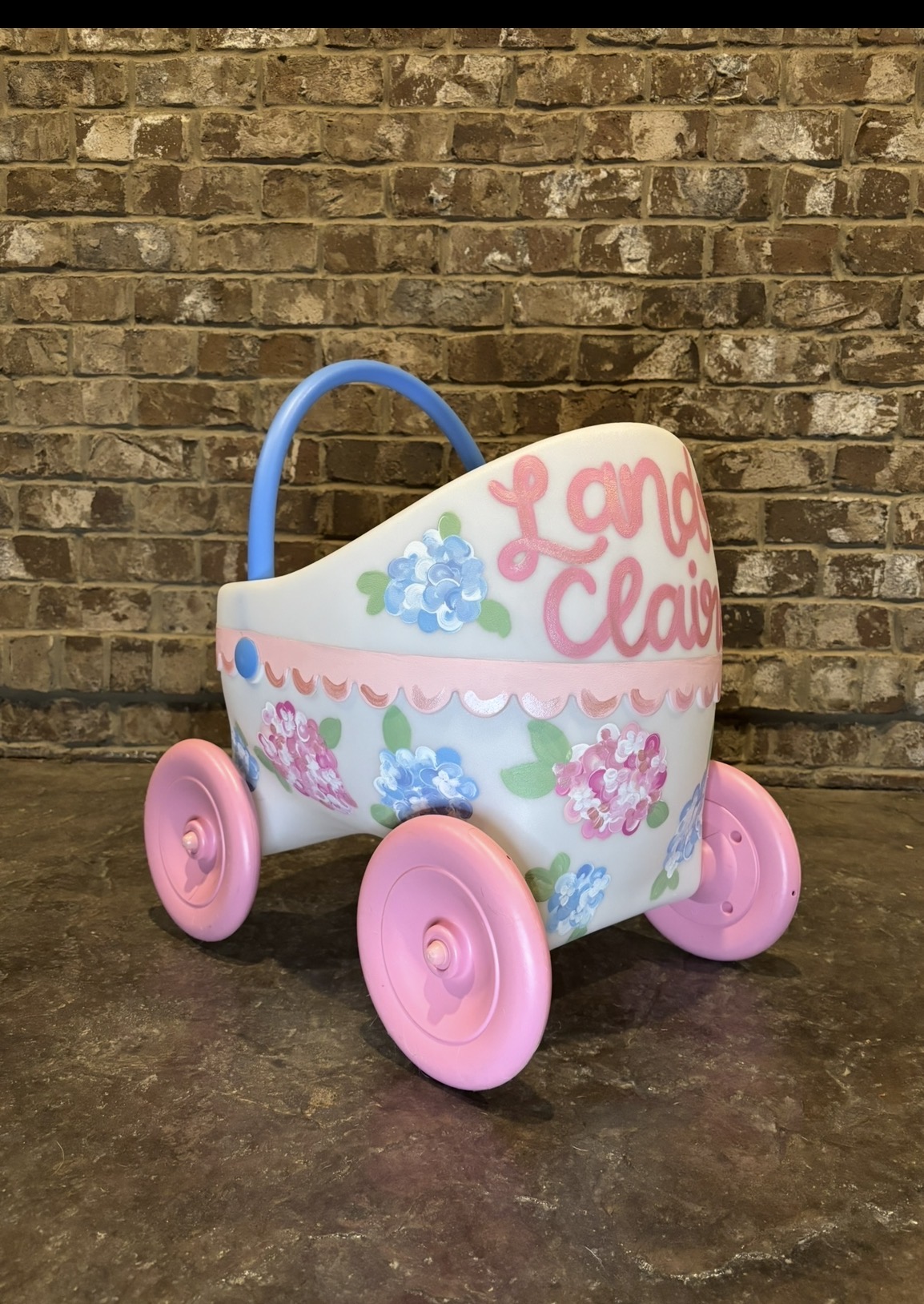 Custom hand-painted decorative baby carriage with hydrangea floral design