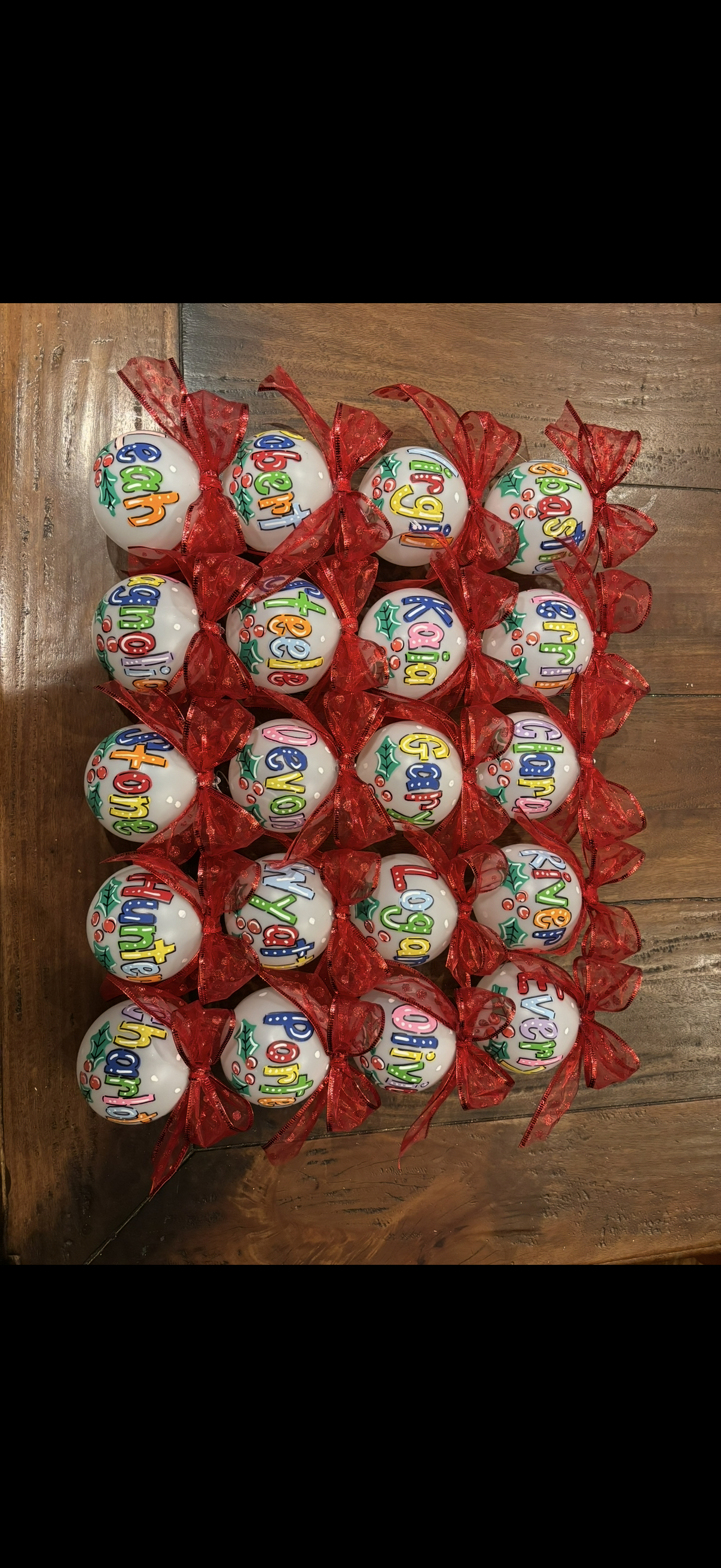 Personalized Christmas ornaments with names and red bows