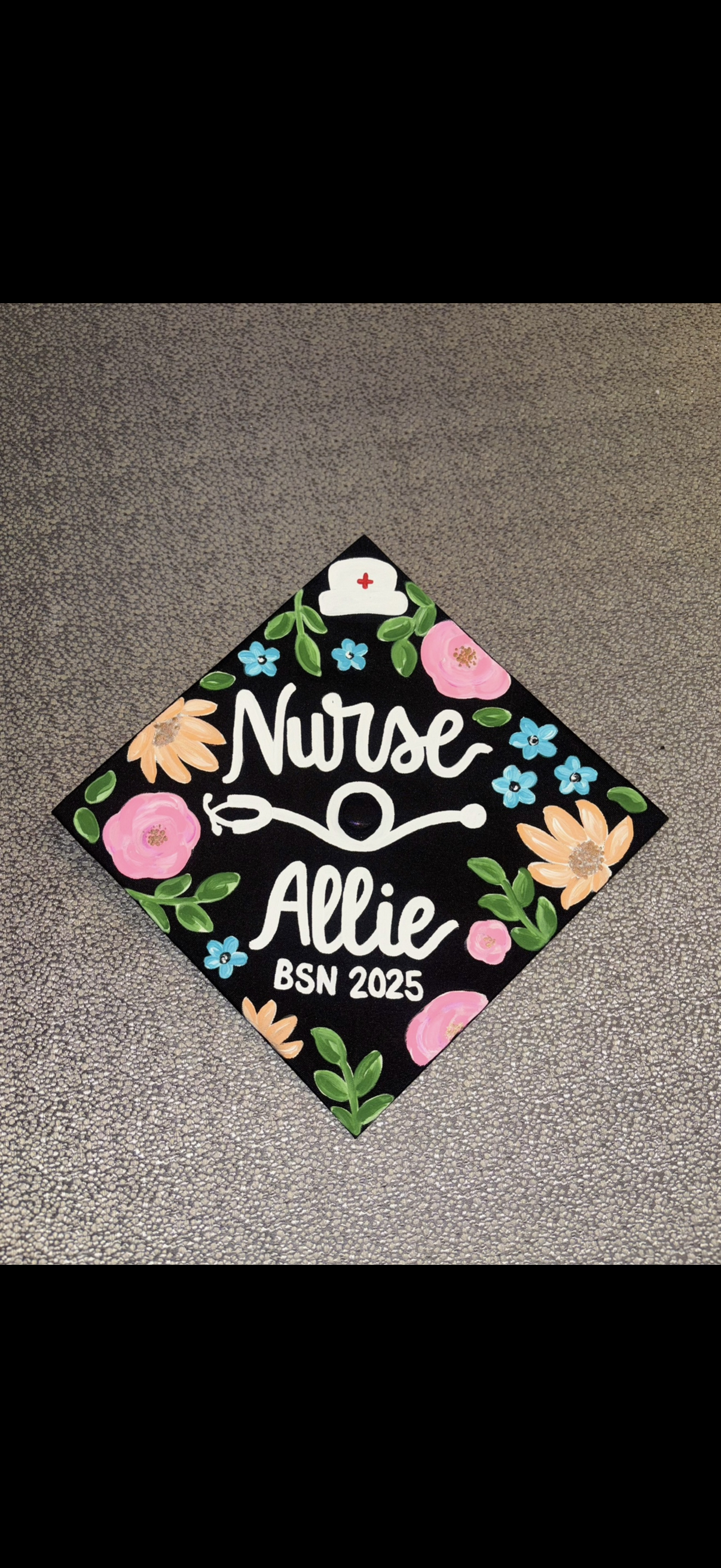Custom hand-painted graduation cap with floral design