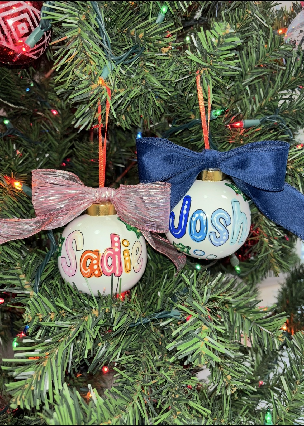 Personalized Christmas ornaments with names and red bows
