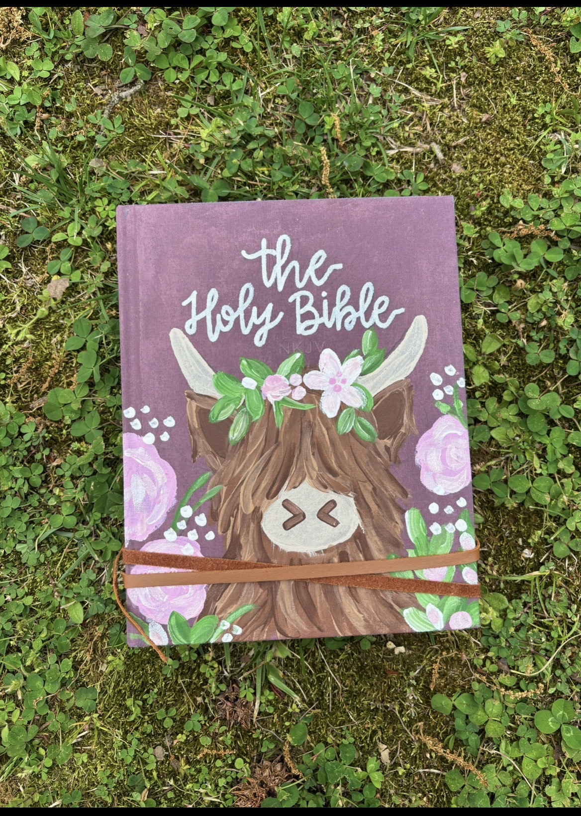 Custom hand-painted Holy Bible with highland cow and floral design